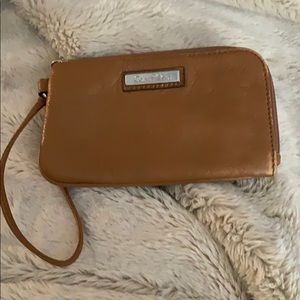 Light brown Calvin Klein wristlet.